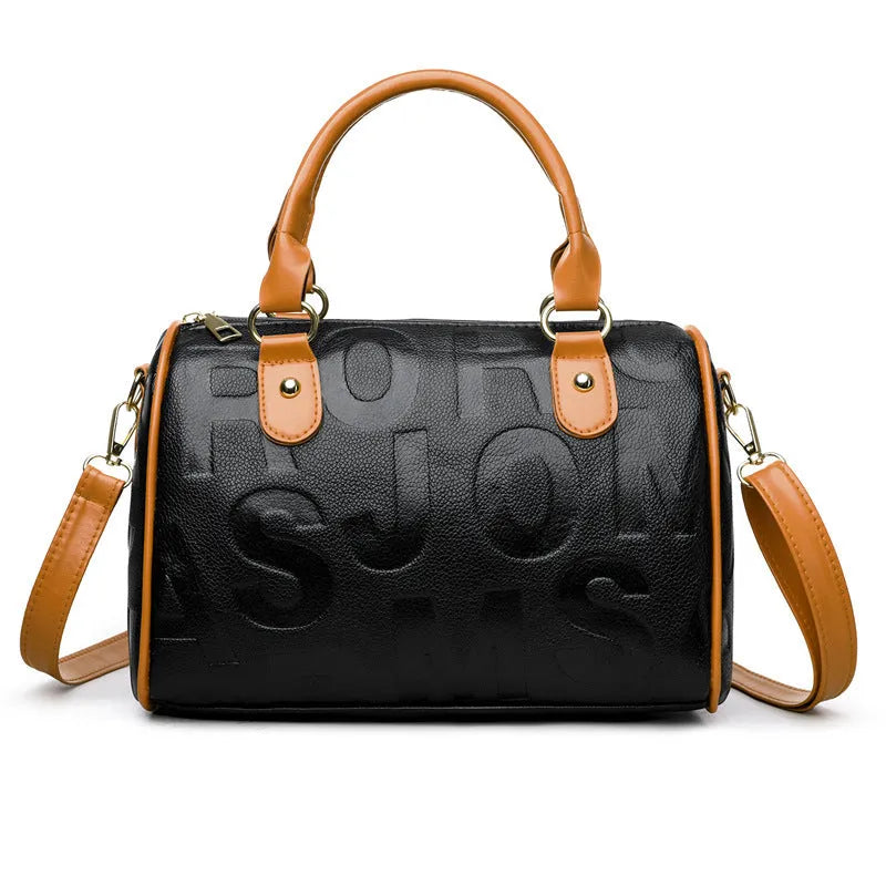 Brown cylindrical PU leather crossbody bag with three shoulder straps showing interior organisation