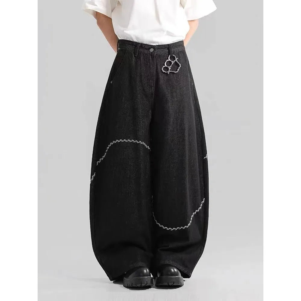 Black straight-leg denim trousers with mid-waist and zip placket on hanger showing micro-elastic polyester fabric