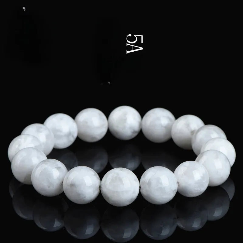 Women's crystal bracelet with round geometric beads in blizzard colour, showing Ruyi and Xiangyun design motifs.