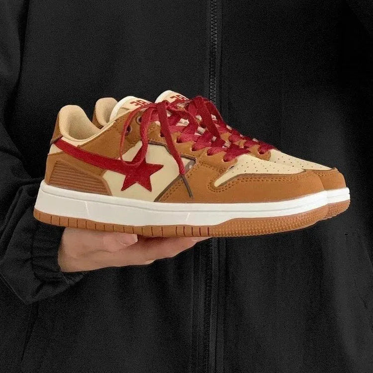 Brown low-top women's platform sneakers with sequin details and lace-up front.