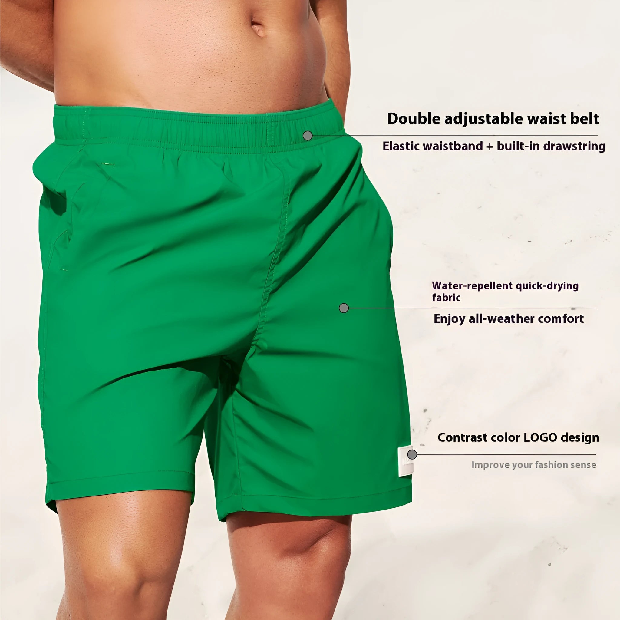 Men's solid colour quick-dry nylon shorts in green, shown with straight leg and elasticated waist.
