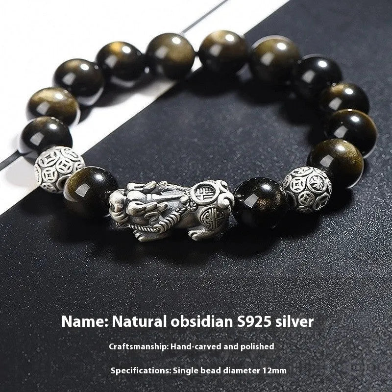 Men's geometric obsidian bracelet in sterling silver showing polished finish and natural stone detailing