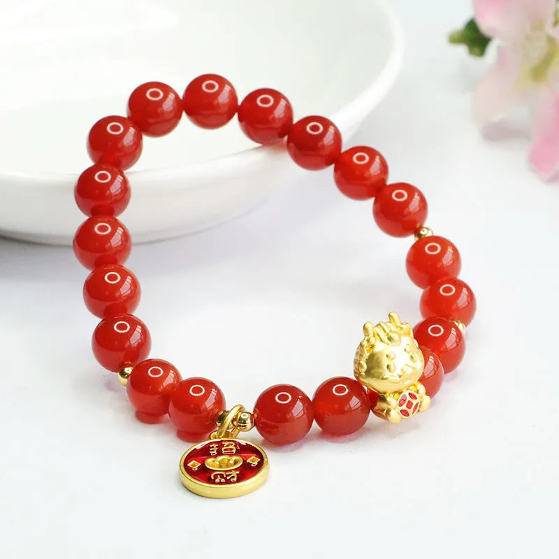 Close-up of a red agate bead dragon zodiac bracelet on a wrist, showing 8mm beads and Chinese style design.