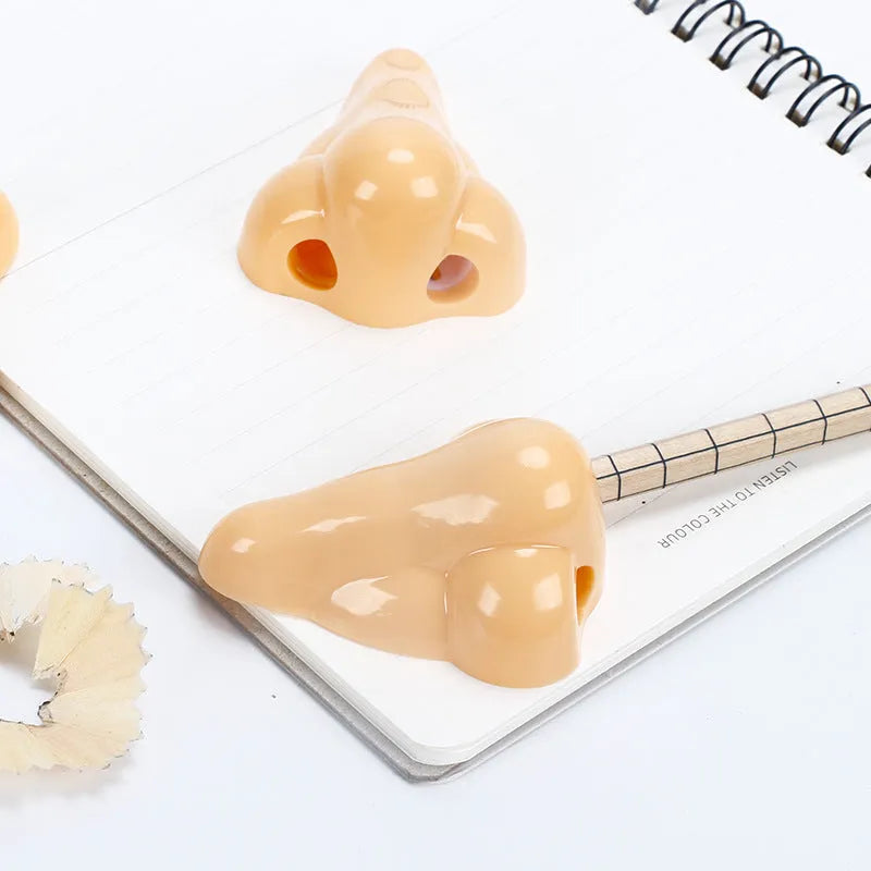 Flesh colour pencil sharpener with 58x45x30mm geometry shape and big nostril design for student stationery