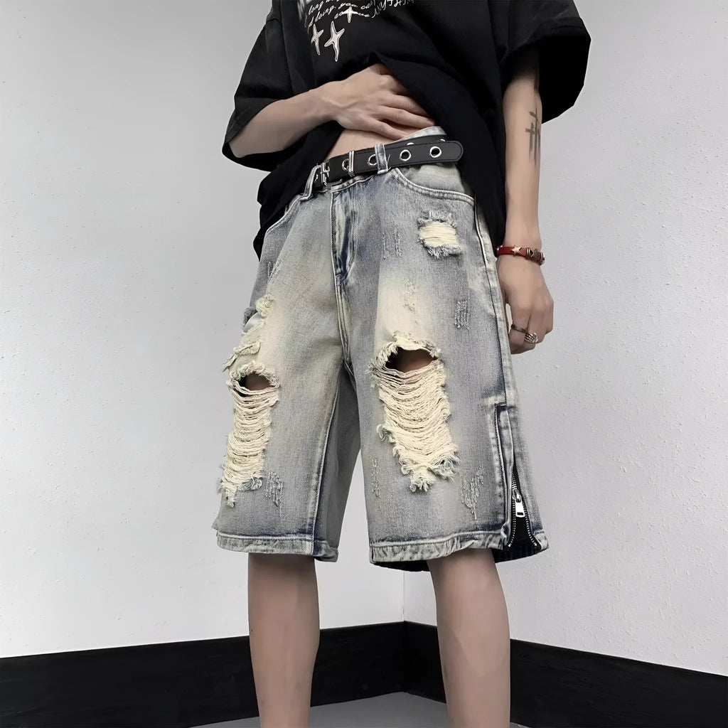 Blue retro tattered denim shorts with a wide leg loose fit on a neutral background.