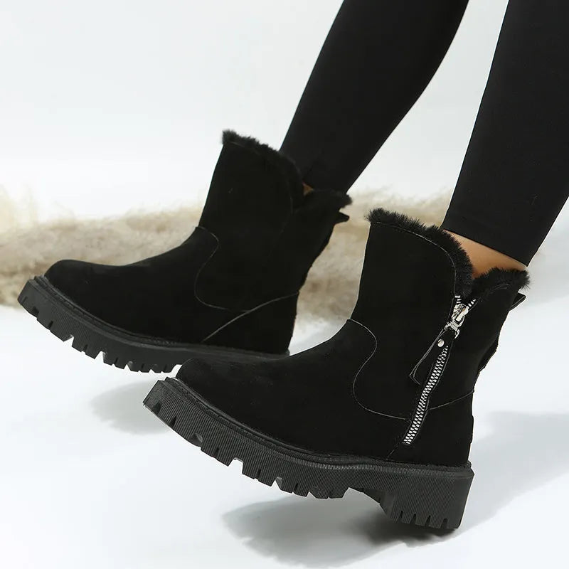 Women's black snow boots with high-top design, side zipper, and non-slip rubber sole for winter