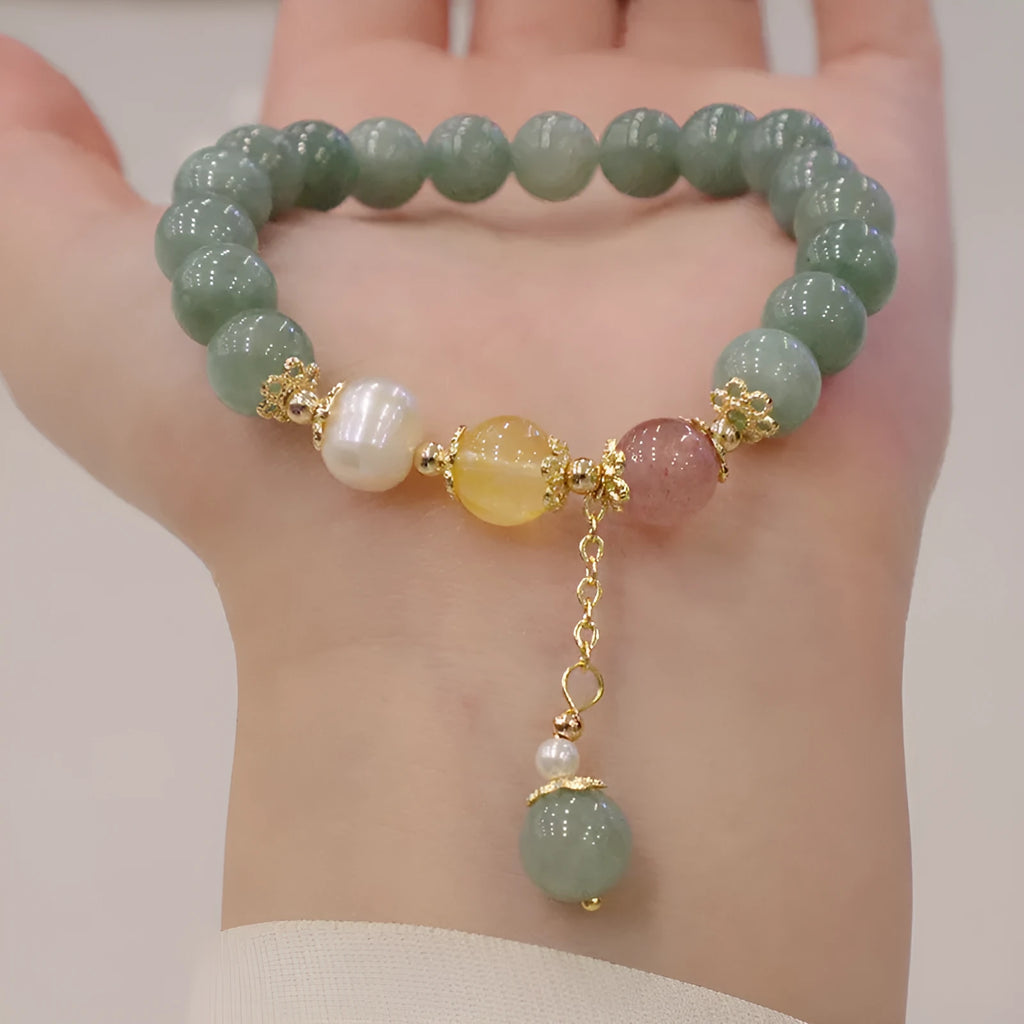 Green Myanmar jade beaded bracelet with pearls and 3D decoration in a geometric Han style design.