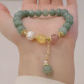 Green Myanmar jade beaded bracelet with pearls and 3D decoration in a geometric Han style design.
