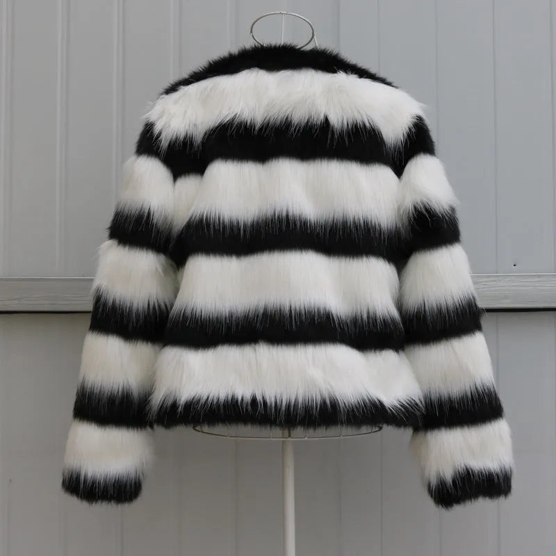 Black and white striped faux fur jacket with long sleeves on female model
