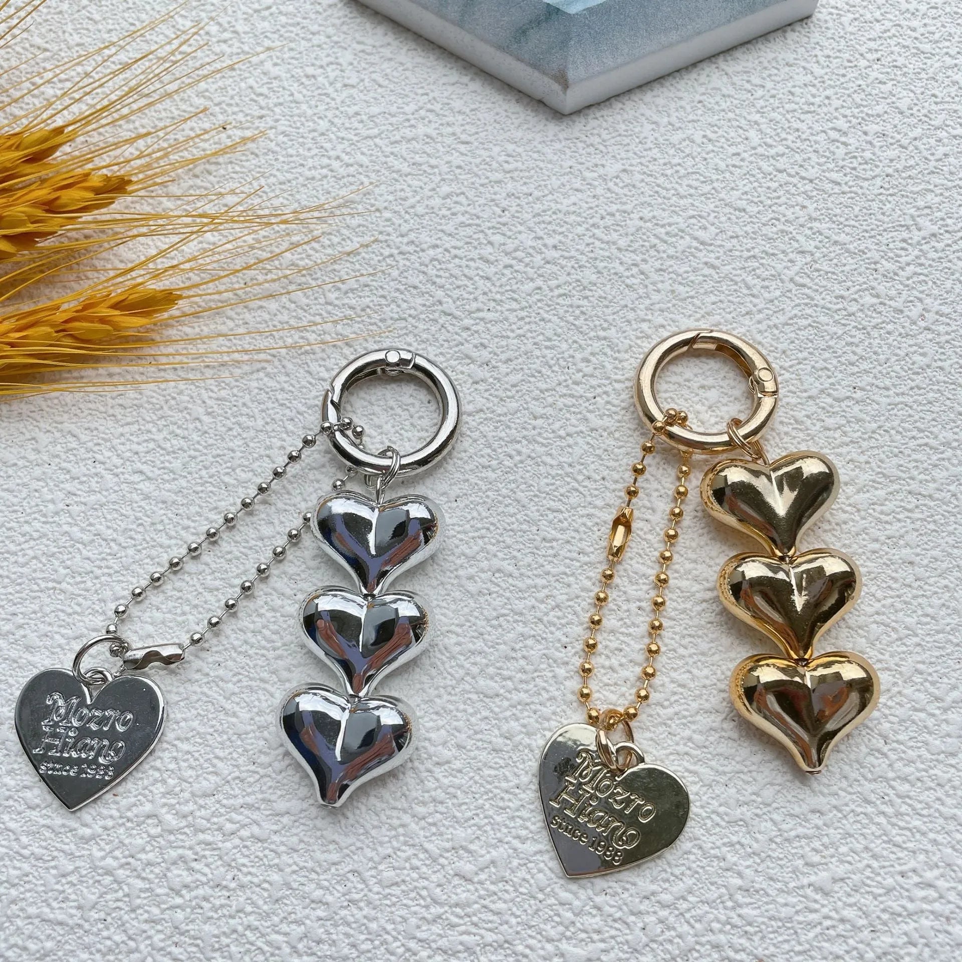 Love heart shaped acrylic charm keychain on an electroplated metal ring in silver finish.