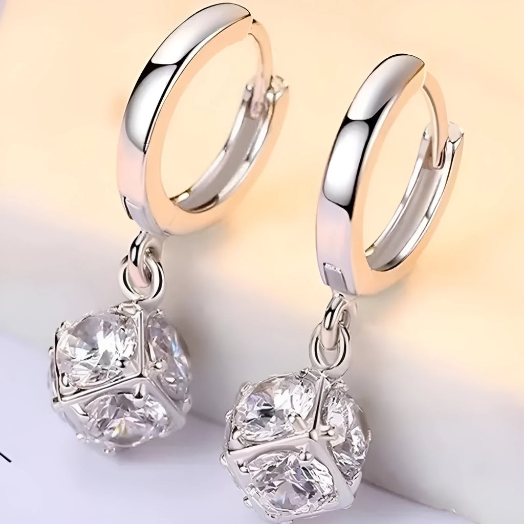 A pair of geometric-shaped zircon and rose element earrings for women, made from electroplated copper.