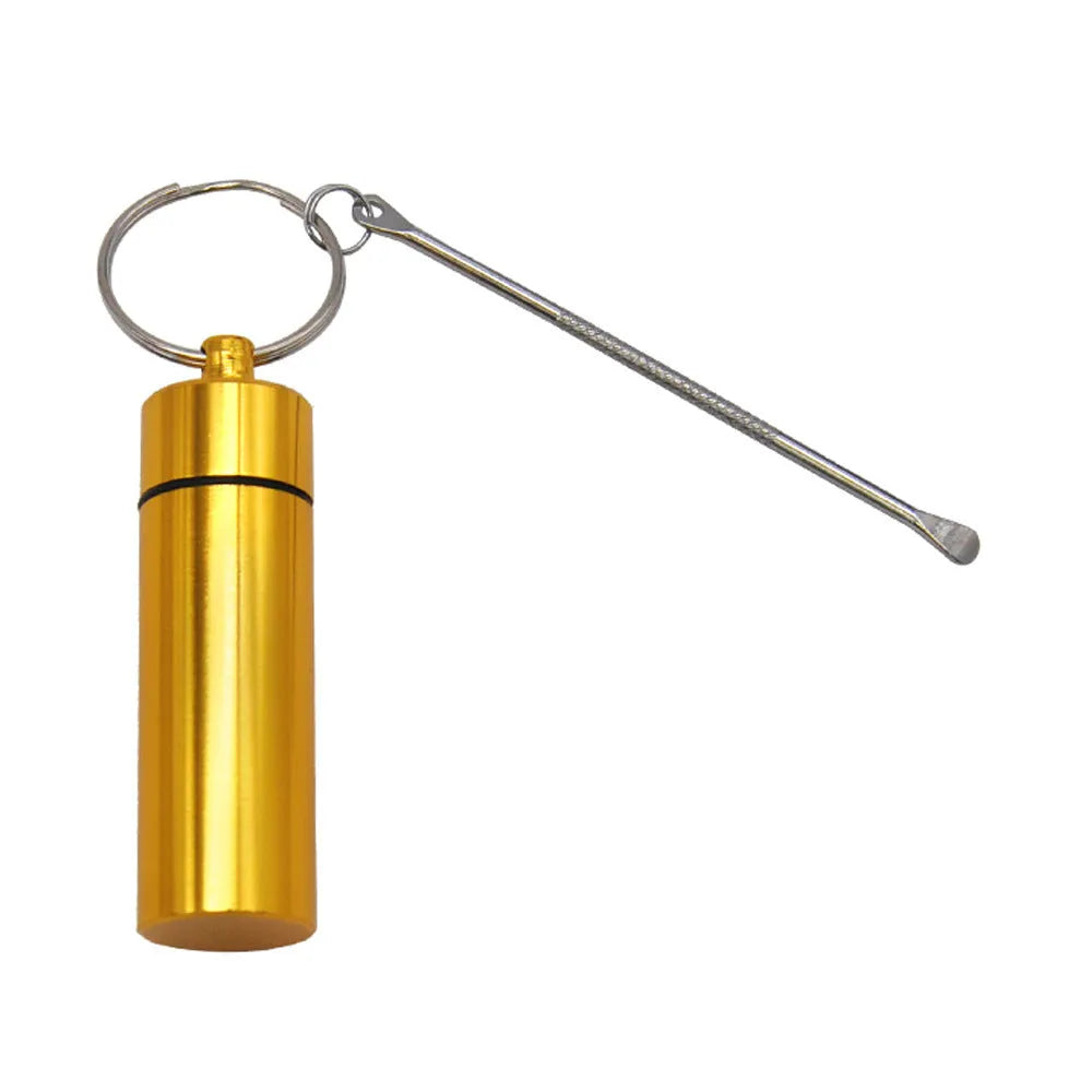 Blue aluminium portable pill box with attached spoon and keychain.