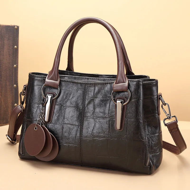 Large capacity shoulder bag with urban simplicity style, showing internal zipper compartments and contrasting sewing thread details