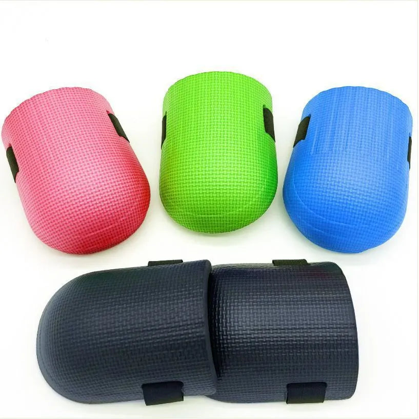 A pair of thick EVA foam kneepads in a chosen colour, shown on a hard tile floor.