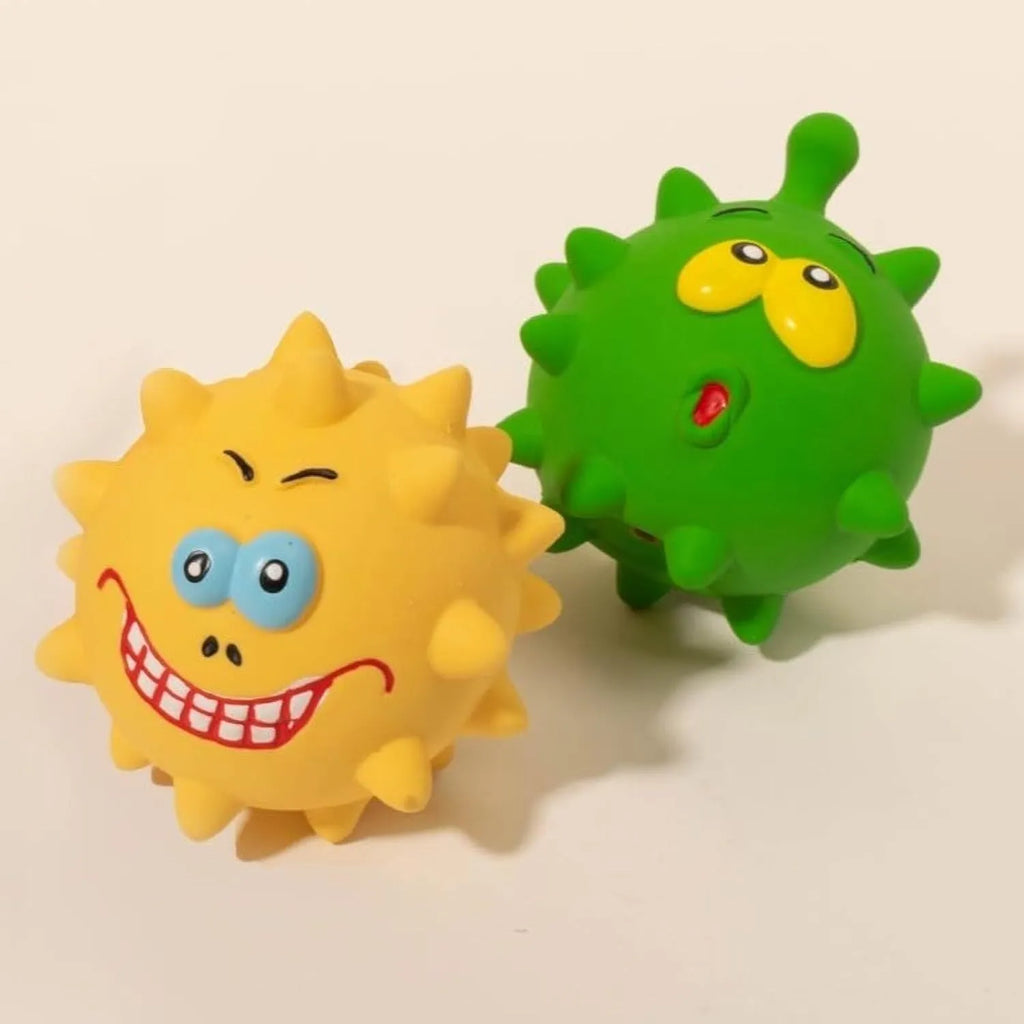 Four colourful squeaky dog balls with cute faces, showing textured surface for dental cleaning, natural latex construction