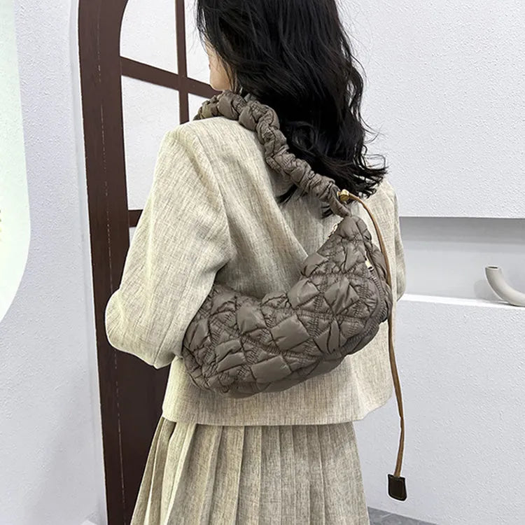 Women's nylon underarm bag in beige colour showing 35cm width and adjustable 120cm shoulder strap