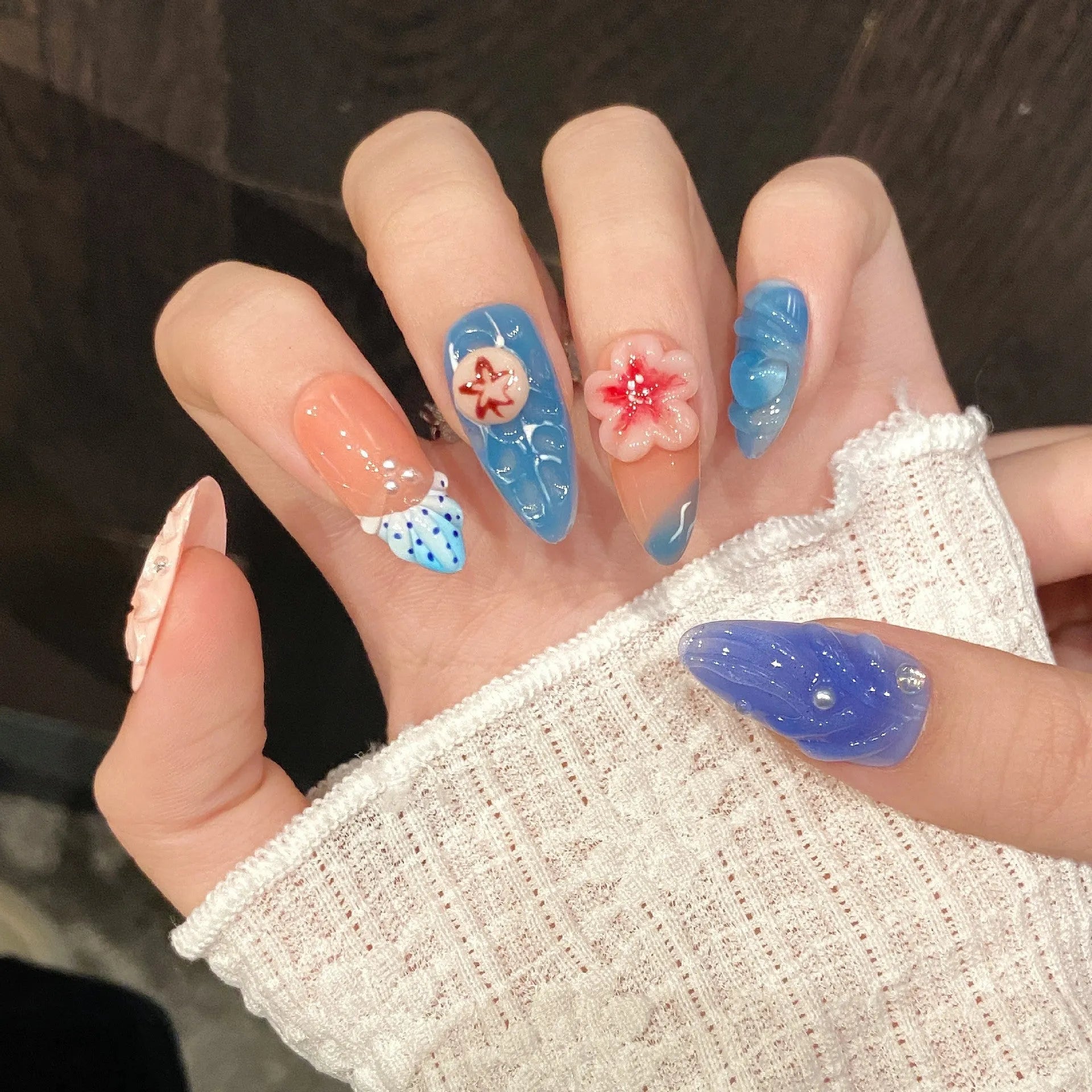 Plastic wearable armour set with three-dimensional carved jellyfish designs and rose patterns in almond nail colour