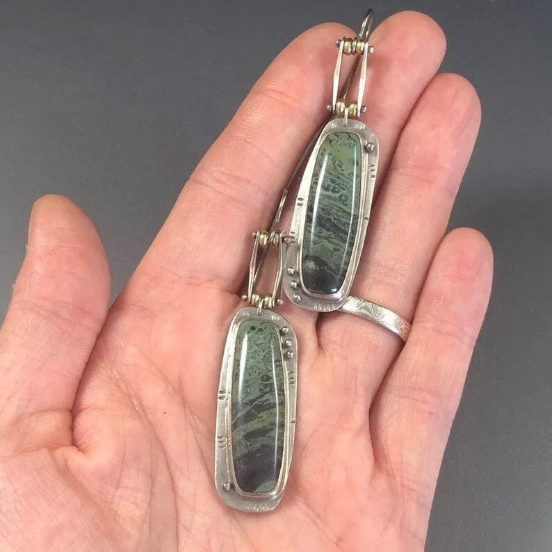 Two-tone geometric marble pattern earrings with alloy construction and post back closure