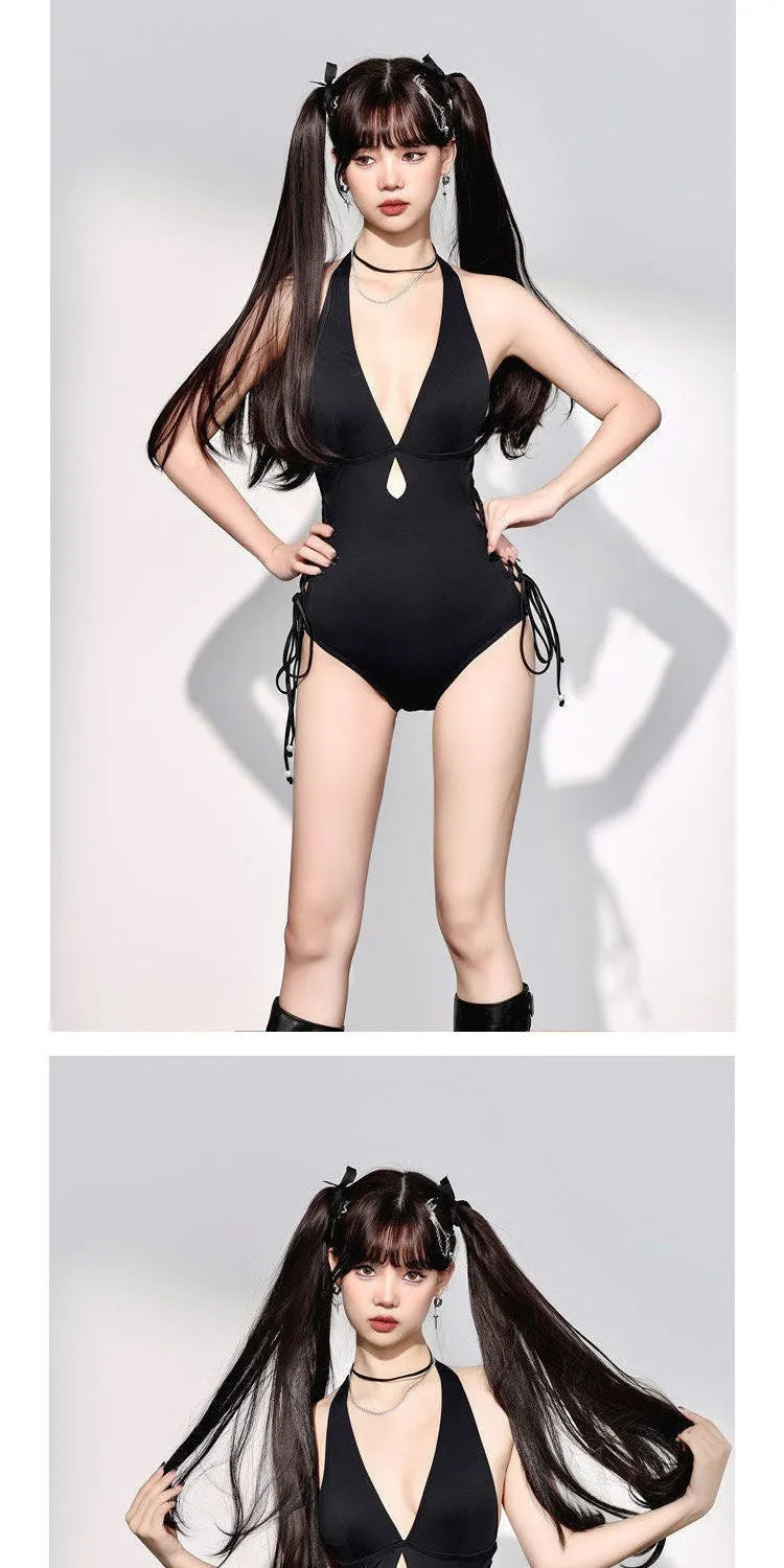 Black women's one-piece swimsuit with V-neck and hollow strap design on a mannequin