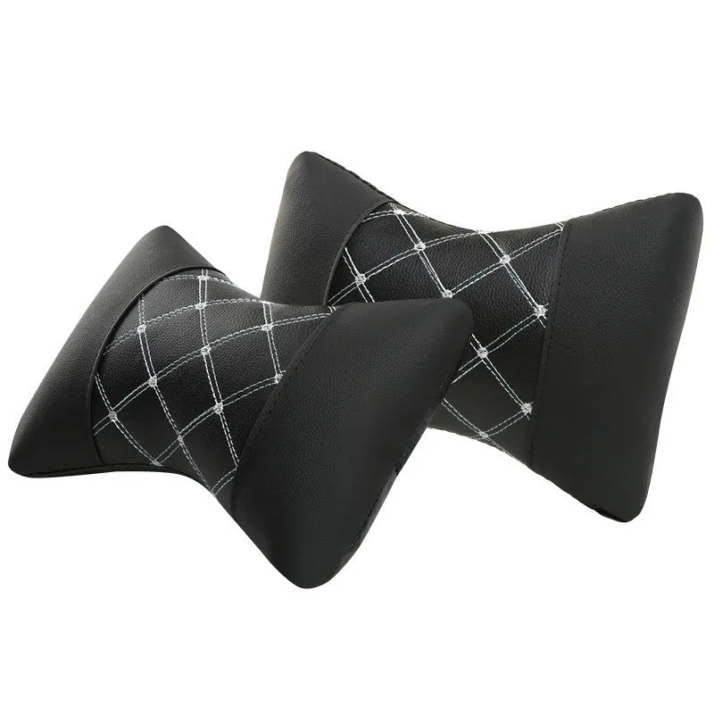 Black quilted car headrest with diamond pattern and contrasting stitching for cervical neck support