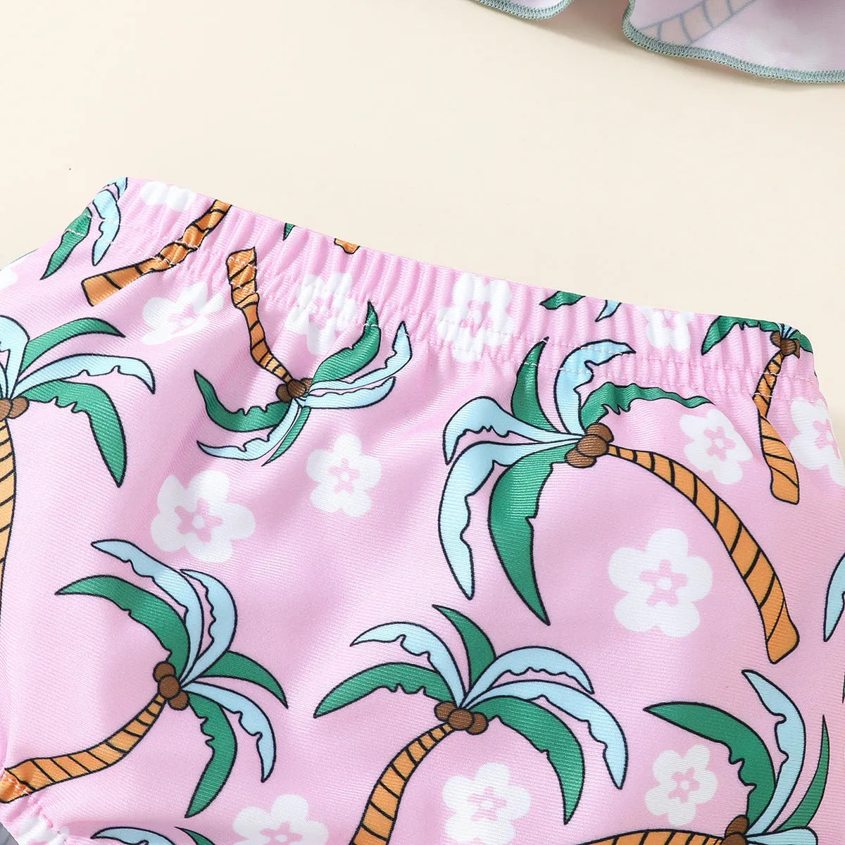 White children's two-piece swimsuit set with shirt and shorts for ages 6 months to 3 years