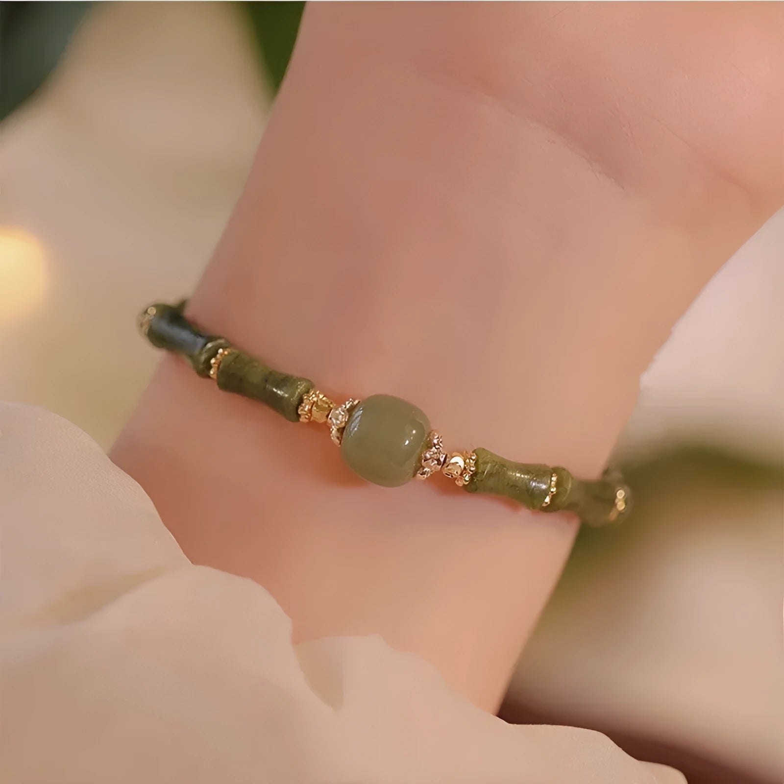 A simple geometric Hetian jade bracelet for women with a Yuan dynasty smoked design, shown in dark green.