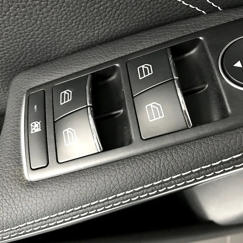 Black glitter window lift button modification sticker measuring 6cm by 3cm with adhesive backing