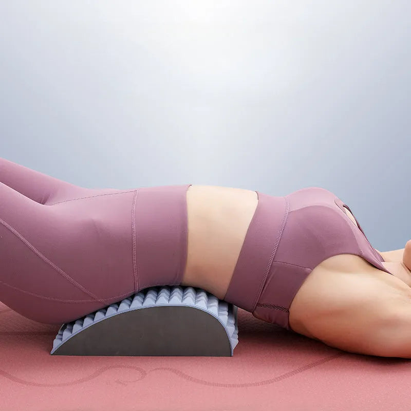 Blue EVA foam back stretcher pillow for lumbar and neck support on a plain background.