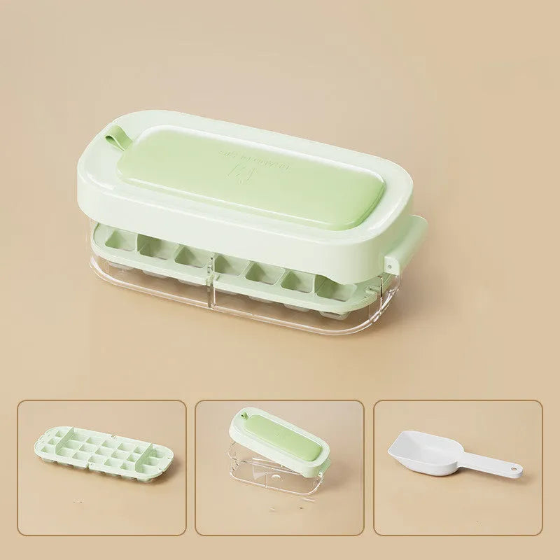 Ice cube tray with leverage demolding system and storage compartment for ice shovel in kitchen setting