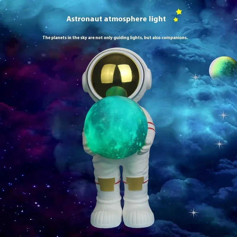 Spaceman-themed starry sky projection lamp with Bluetooth speaker on a bedside table.
