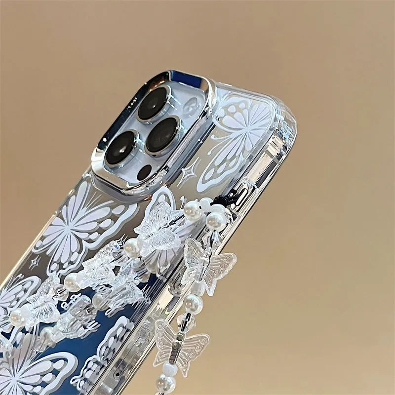 Transparent three-in-one mirror phone case for iPhone with detachable bracelet, showing bow decoration.