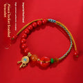 Hand-woven cinnabar bracelet with geometric peace blessing buckle in emperor red sand colour