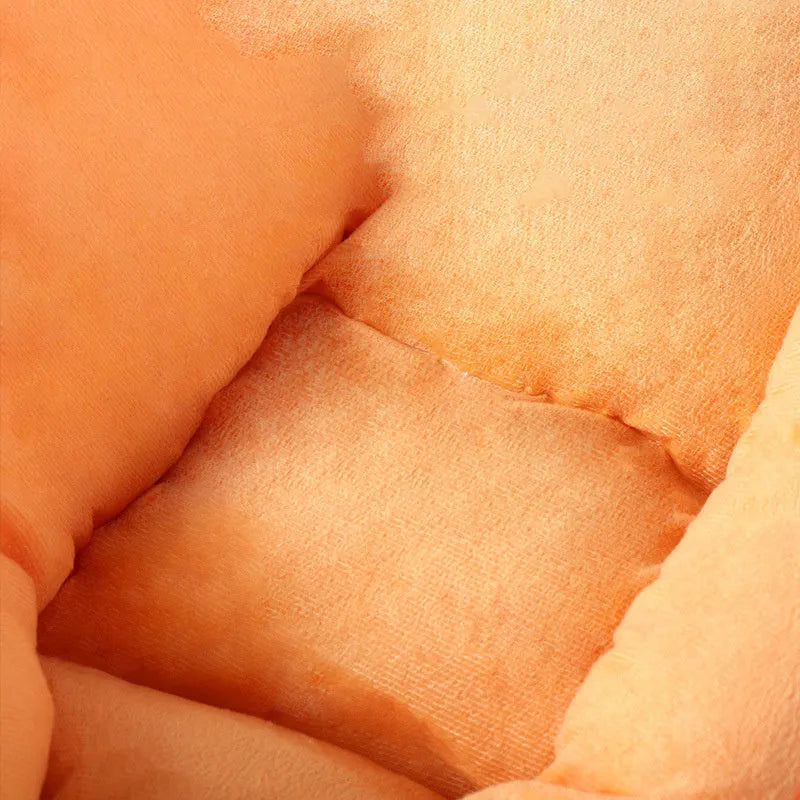 Carrot-shaped nesting dog bed with washable blanket for small or medium-sized pets