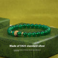 Green agate and sterling silver bracelet with yellow gold plating and a geometric bead.