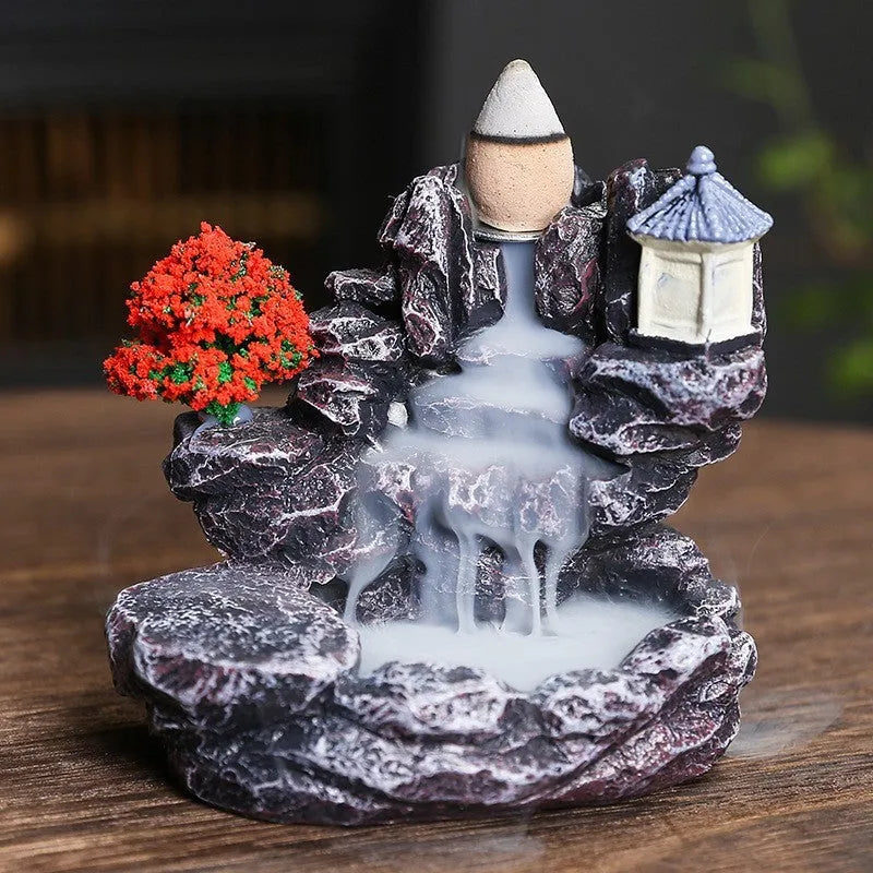 Modern ceramic backflow incense burner with sandal ornament in green tree design.