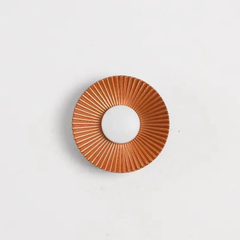 Round wall lamp with aluminium shade and LED light source for bedroom lighting