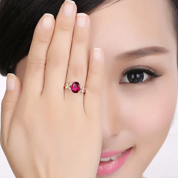Women's 18k rose gold plated copper butterfly ring in a heart shape, shown in red and blue colour options.