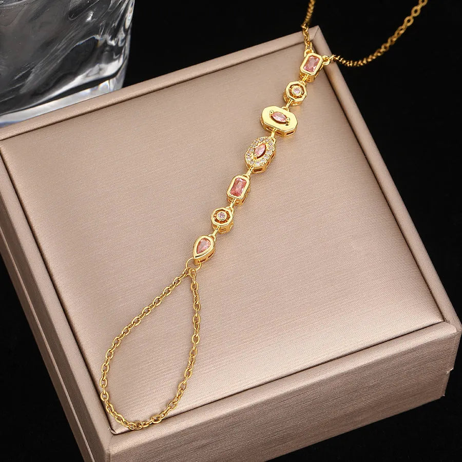 Titanium steel tassel rhinestone finger chain bracelet in drop shape, gold or silver colour options