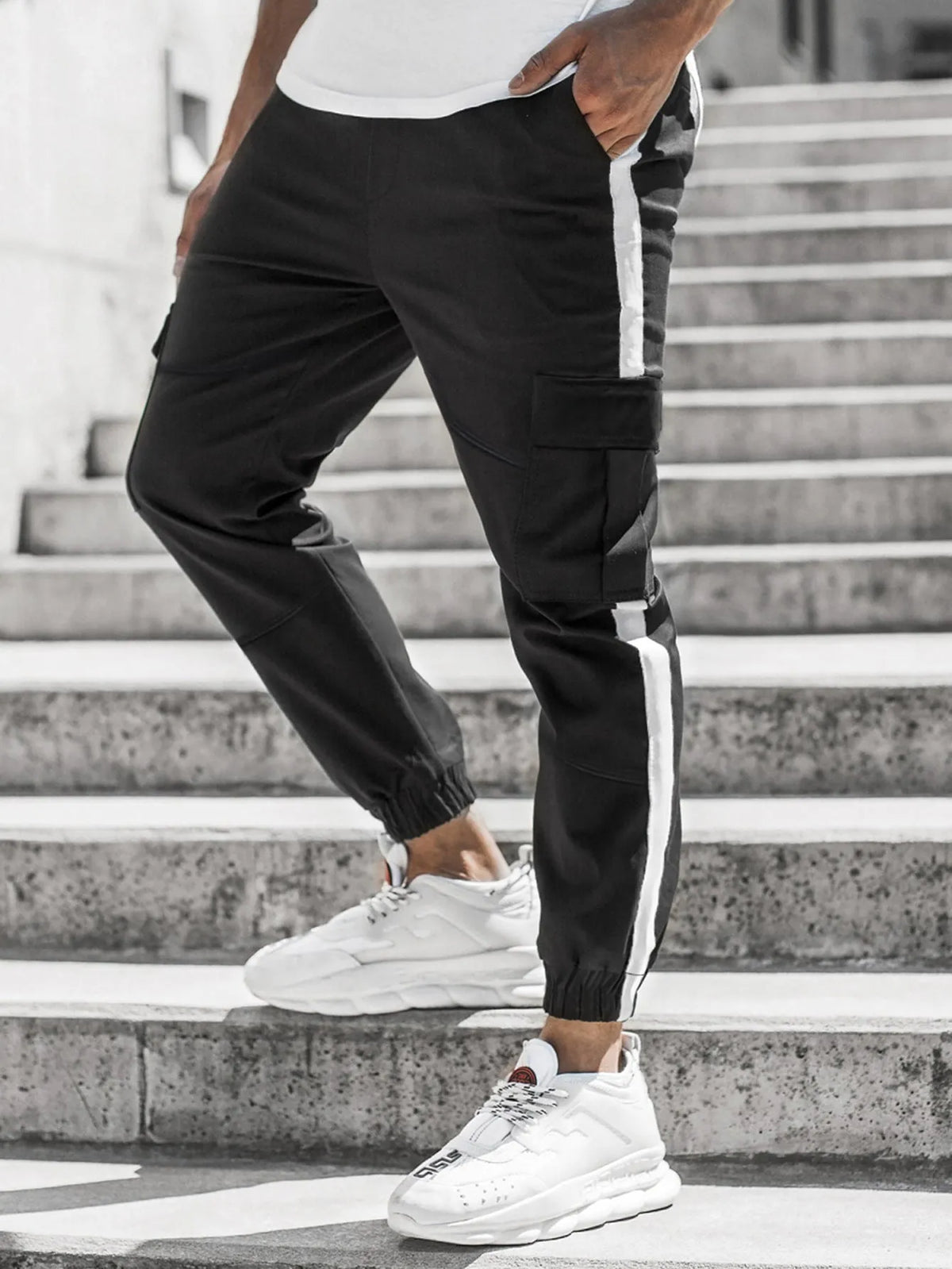 Men's leather-look casual trousers in khaki, black, or dark grey with middle waist and zip fly.