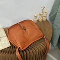 Brown retro-style genuine leather messenger bag with flap closure and crossbody strap