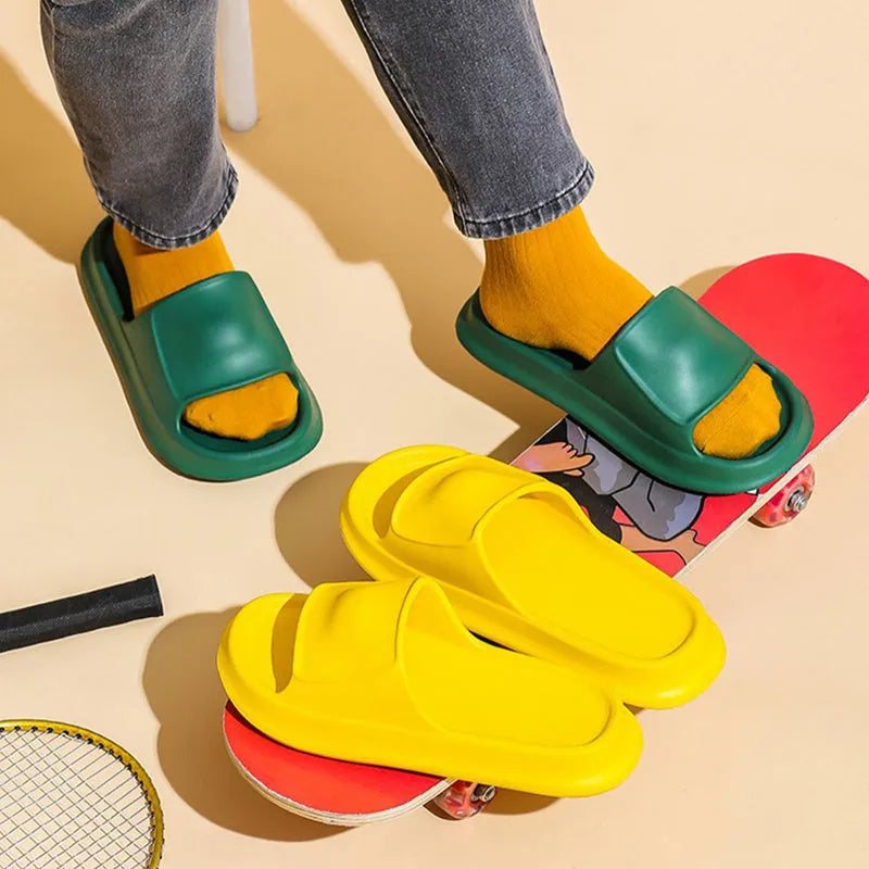 EVA flip-flop slippers with thick sole in multiple colours on a bathroom floor