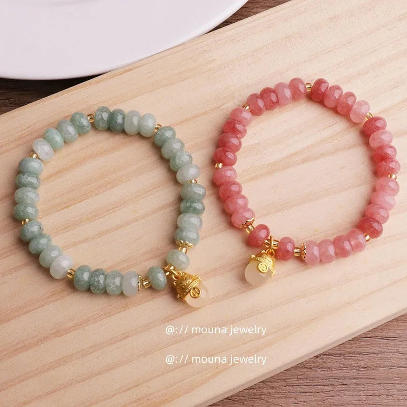Women's strawberry quartz lucky cat bracelet with animal zodiac charm and retro styling