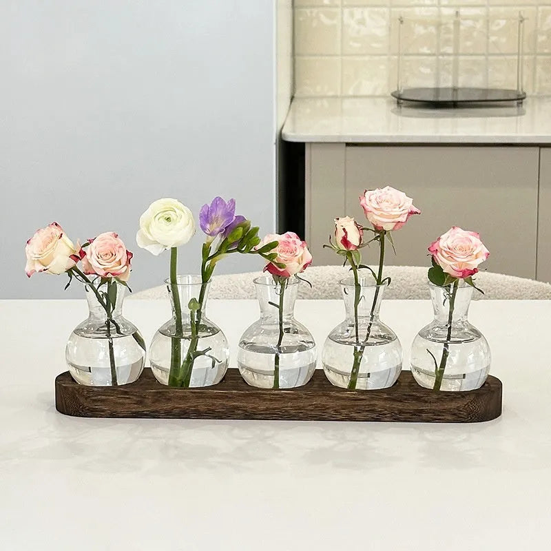 Wooden frame holding transparent PET hydroponic vases in wood colour, arranged neatly for plant display