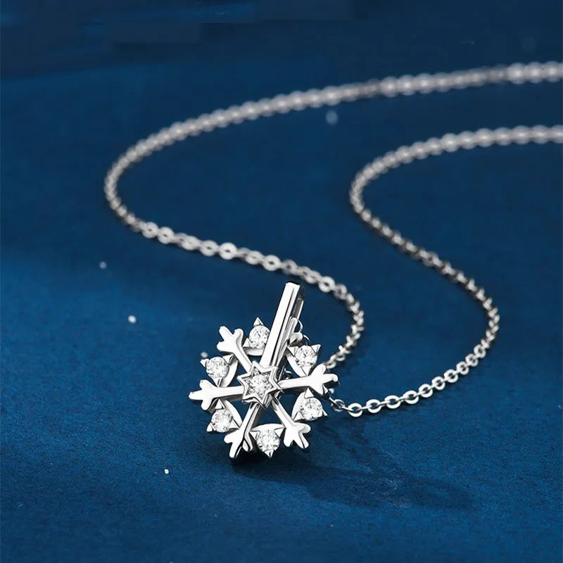 Rotatable S925 silver snowflake necklace for women with rhinestone detail, available in rose gold or white gold.