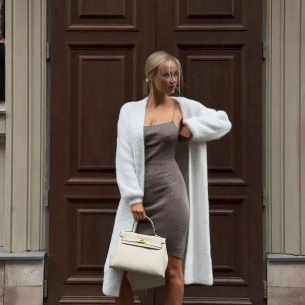 White women's knitted cardigan jacket with 105cm length and loose fit, shown in commute style