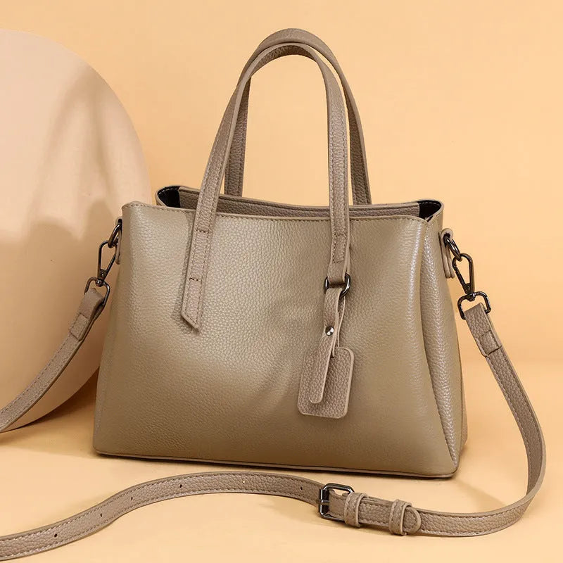 Women's cowhide leather shoulder handbag in horizontal square shape with contrast colour details and single strap