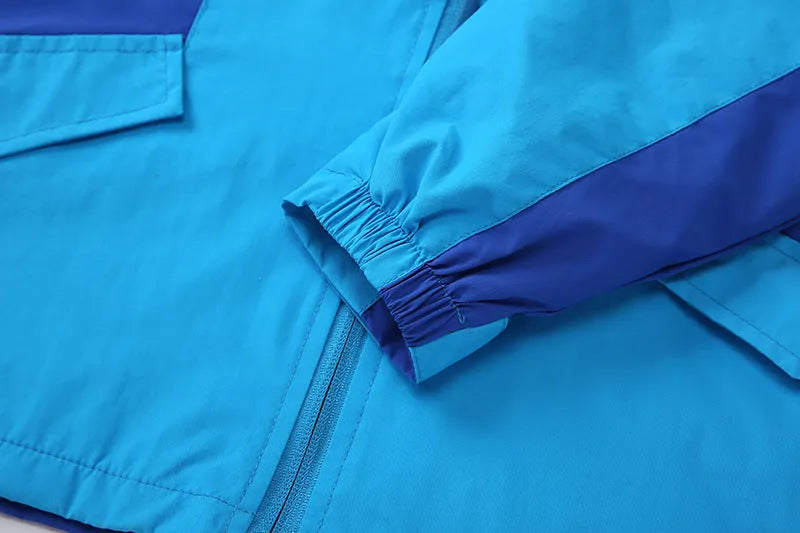 Blue thin children's jacket with full zip and long sleeves for ages 8+