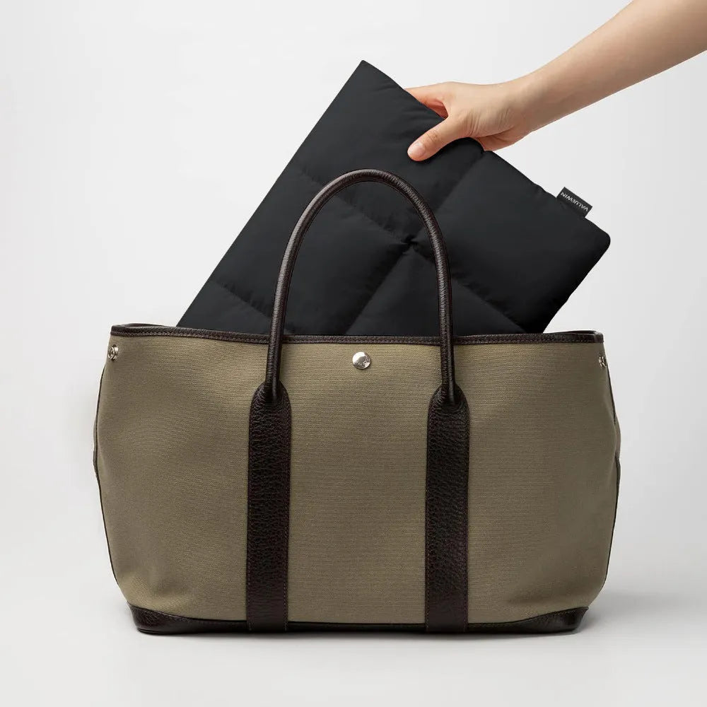 Soft and fluffy laptop sleeve in black or khaki with retro sewing thread details, sized for 13-15.6 inch devices