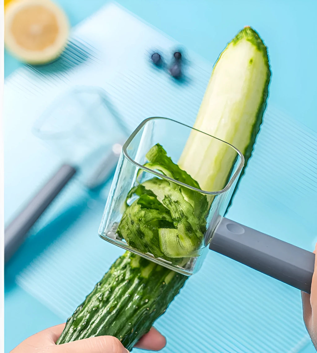 Creative stainless steel kitchen peeler with a coloured PP handle on a white background.
