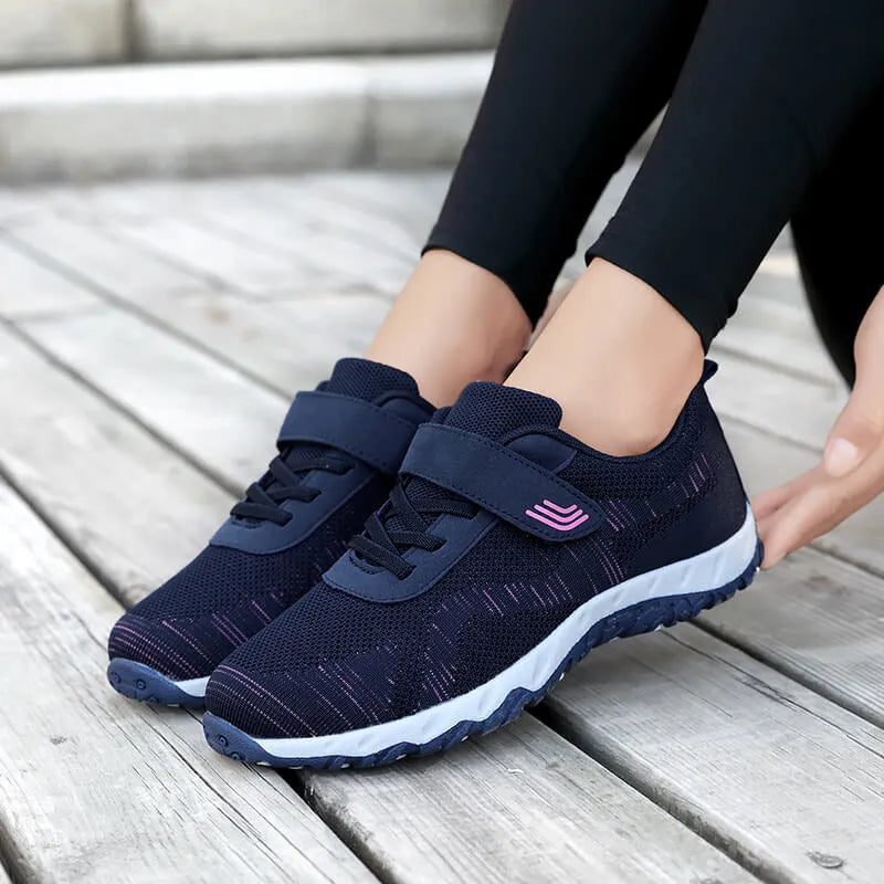 Women's low-top wedge shoes with Velcro strap and mesh upper in a solid colour